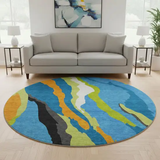8' Denim Blue Orange And Lime Green Abstract Washable Round Rug With UV Protection Photo 2