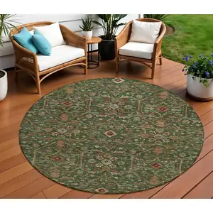Photo of 8' Emerald Brown And Red Round Floral Washable Indoor Outdoor Area Rug