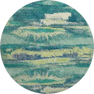 Photo of 8' Emerald Ivory And Teal Abstract Washable Round Rug With UV Protection