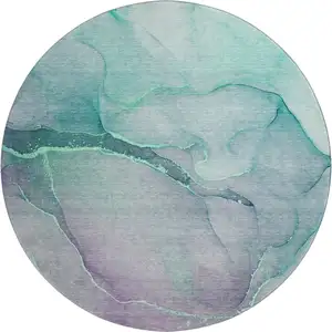 Photo of 8' Fern Green And Ivory Abstract Washable Round Rug With UV Protection