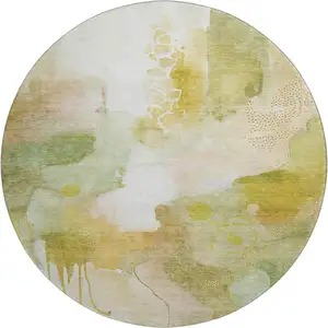 Photo of 8' Fern Green And Ivory Abstract Washable Round Rug With UV Protection