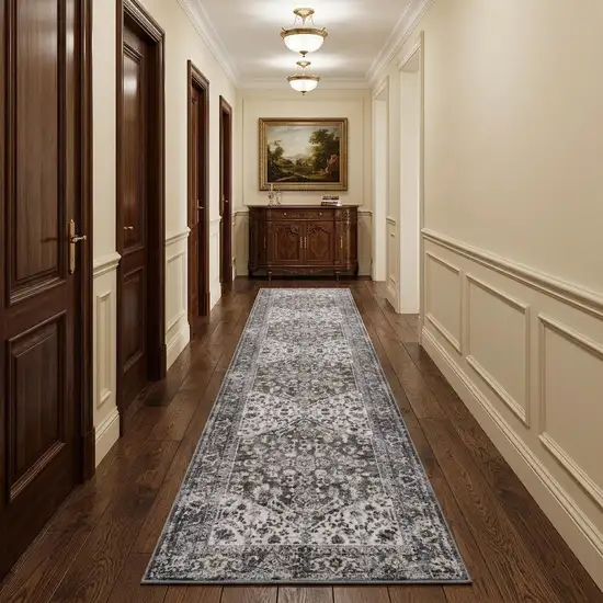 10' Green and Ivory Floral Power Loom Distressed Washable Runner Rug Photo 1