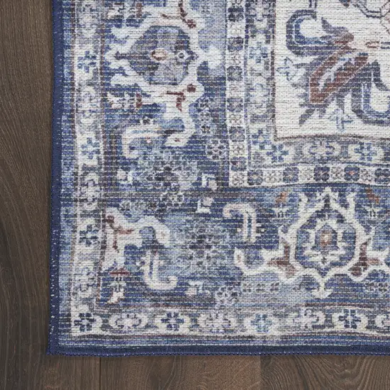 10' Blue and Ivory Floral Power Loom Distressed Washable Runner Rug Photo 7
