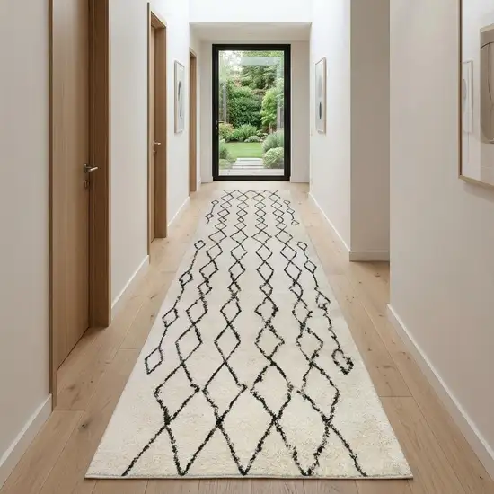 10' Black and Ivory Geometric Shag Runner Rug Photo 1