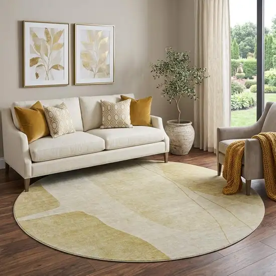 8' Gold And Beige Abstract Washable Round Rug With UV Protection Photo 1