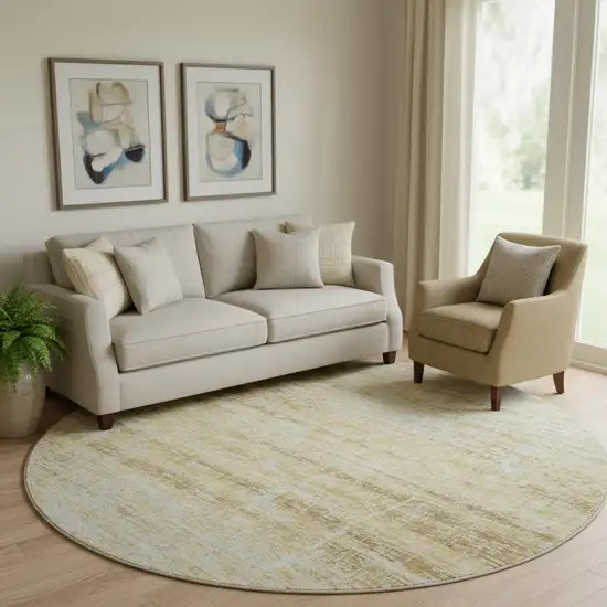 8' Gold And Beige Abstract Washable Round Rug With UV Protection Photo 1