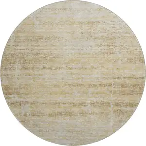 Photo of 8' Gold And Beige Abstract Washable Round Rug With UV Protection