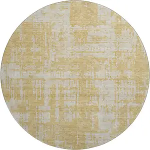 Photo of 8' Gold And Beige Abstract Washable Round Rug With UV Protection