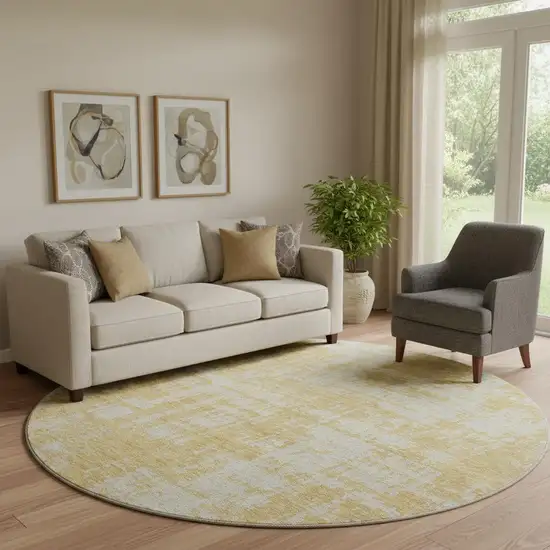 8' Gold And Beige Abstract Washable Round Rug With UV Protection Photo 1