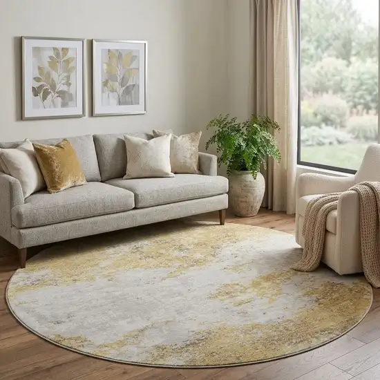 8' Gold And Beige Abstract Washable Round Rug With UV Protection Photo 1