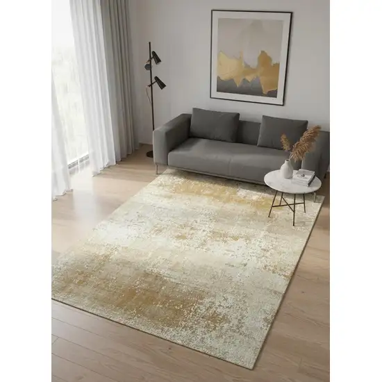 8' Gold And Beige Abstract Washable Round Rug With UV Protection Photo 1