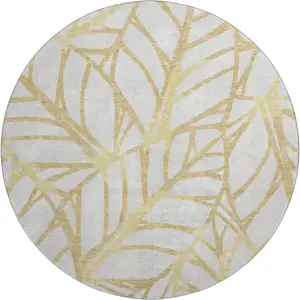 Photo of 8' Gold And Beige Floral Washable Round Rug With UV Protection