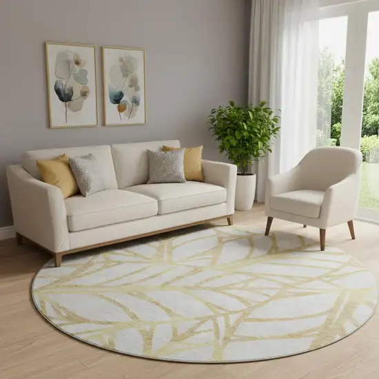 8' Gold And Beige Floral Washable Round Rug With UV Protection Photo 1