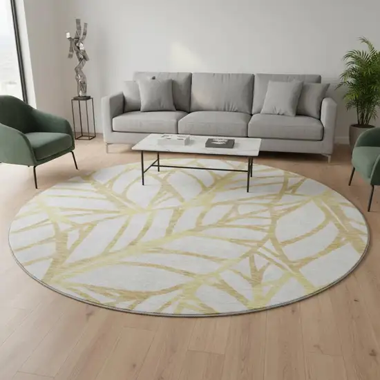 8' Gold And Beige Floral Washable Round Rug With UV Protection Photo 2