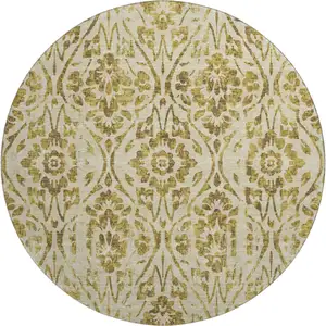 Photo of 8' Gold And Beige Floral Washable Round Rug With UV Protection