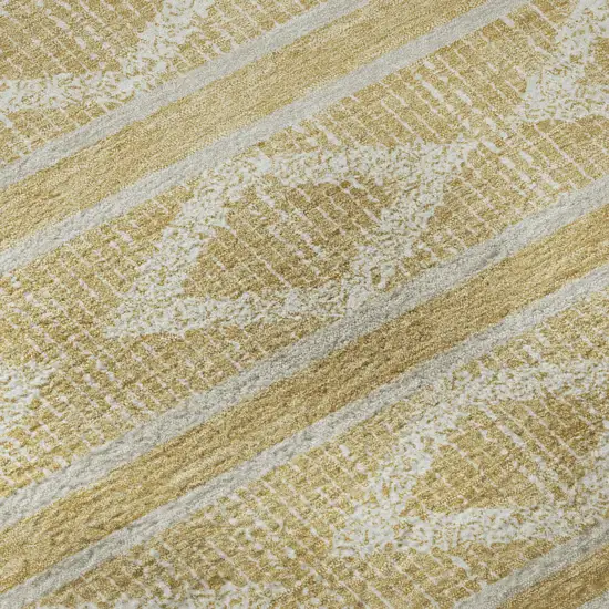 8' Gold And Beige Geometric Washable Round Rug With UV Protection Photo 8