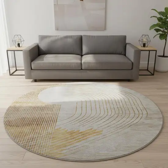 8' Gold And Beige Geometric Washable Round Rug With UV Protection Photo 2