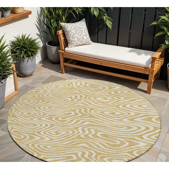 8' Gold And Beige Round Abstract Washable Indoor Outdoor Area Rug Photo 1