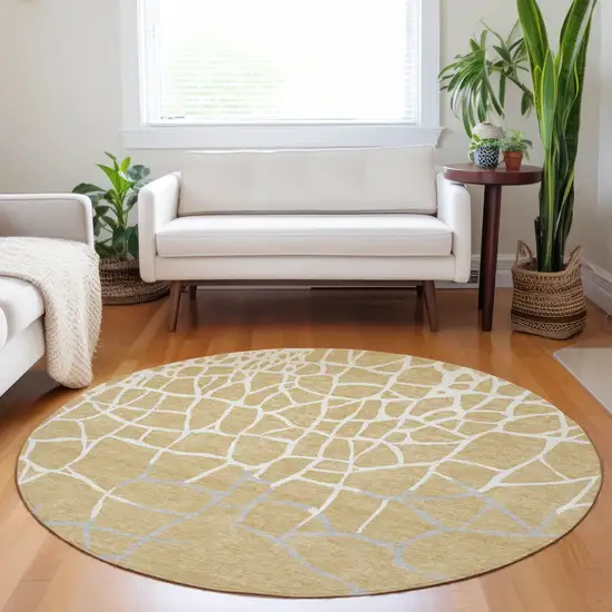 8' Gold And Beige Round Abstract Washable Indoor Outdoor Area Rug Photo 7