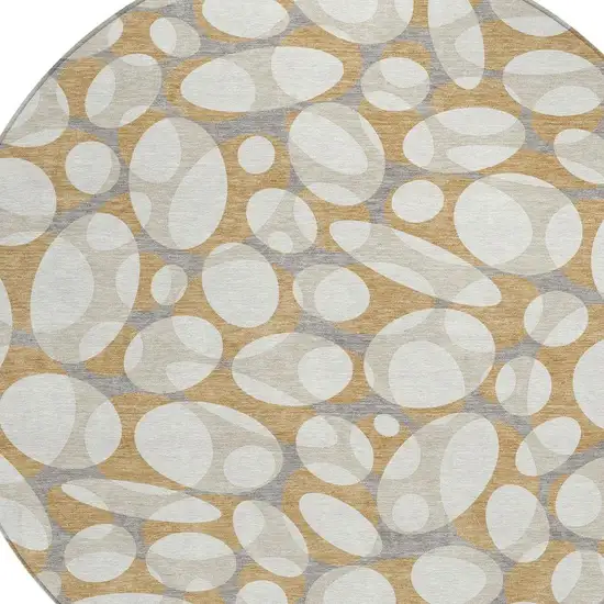 8' Gold And Beige Round Abstract Washable Indoor Outdoor Area Rug Photo 2