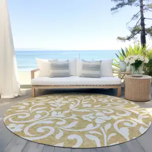 Photo of 8' Gold And Beige Round Floral Washable Indoor Outdoor Area Rug
