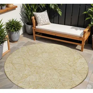 Photo of 8' Gold And Beige Round Floral Washable Indoor Outdoor Area Rug