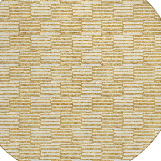 8' Gold And Beige Round Geometric Washable Indoor Outdoor Area Rug Photo 5