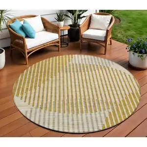 Photo of 8' Gold And Beige Round Geometric Washable Indoor Outdoor Area Rug