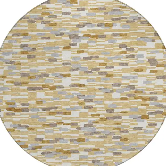 8' Gold And Beige Round Geometric Washable Indoor Outdoor Area Rug Photo 1