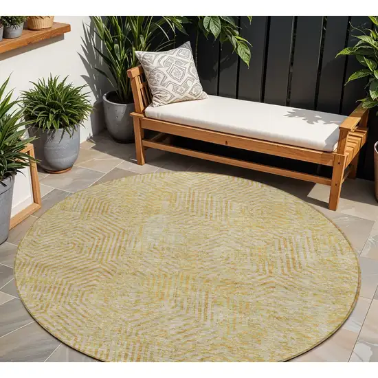 8' Gold And Beige Round Geometric Washable Indoor Outdoor Area Rug Photo 1