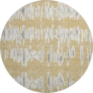 Photo of 8' Gold And Beige Striped Washable Round Rug With UV Protection