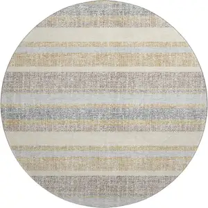 Photo of 8' Gold And Beige Striped Washable Round Rug With UV Protection