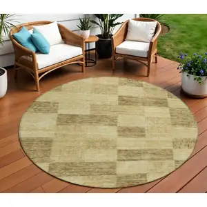 Photo of 8' Gold And Brown Round Geometric Washable Indoor Outdoor Area Rug