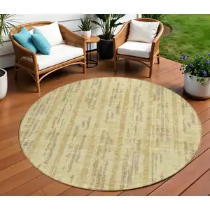 Photo of 8' Gold And Brown Round Striped Washable Indoor Outdoor Area Rug