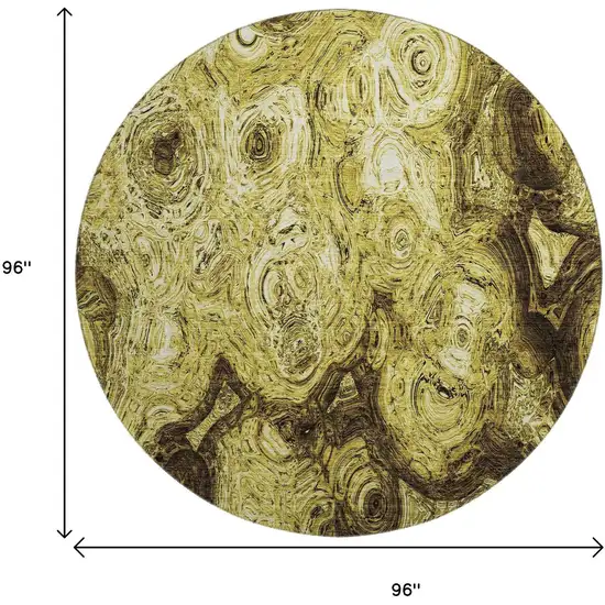 8' Gold And Chocolate Abstract Washable Round Rug With UV Protection Photo 9