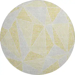Photo of 8' Gold And Gray Geometric Washable Round Rug With UV Protection