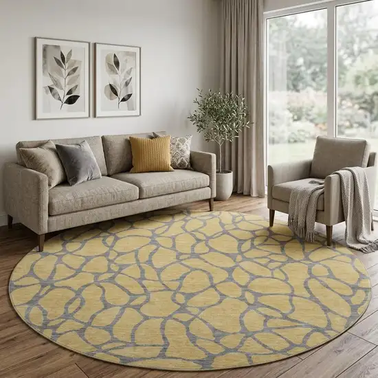 8' Gold And Gray Geometric Washable Round Rug With UV Protection Photo 1