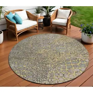 Photo of 8' Gold And Gray Round Abstract Washable Indoor Outdoor Area Rug