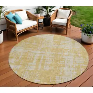Photo of 8' Gold And Gray Round Abstract Washable Indoor Outdoor Area Rug