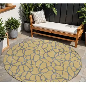 Photo of 8' Gold And Gray Round Geometric Washable Indoor Outdoor Area Rug