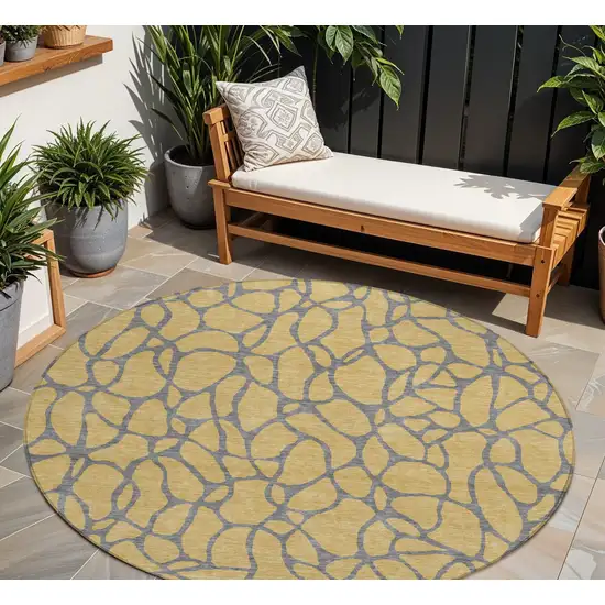 8' Gold And Gray Round Geometric Washable Indoor Outdoor Area Rug Photo 1
