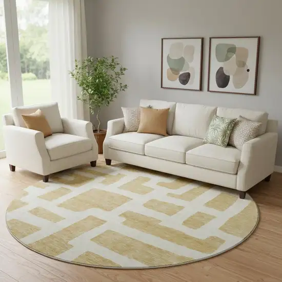 8' Gold And Ivory Abstract Geometric Washable Round Rug With UV Protection Photo 1