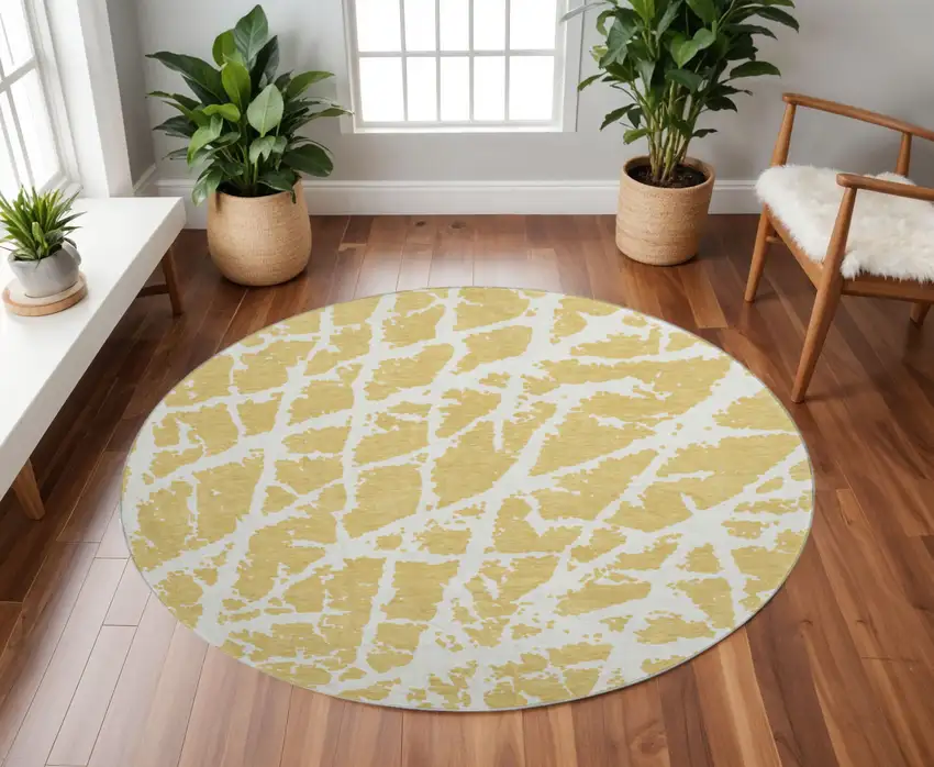 8' Gold And Ivory Abstract Washable Round Rug With UV Protection Photo 2