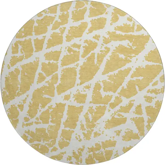 8' Gold And Ivory Abstract Washable Round Rug With UV Protection Photo 1