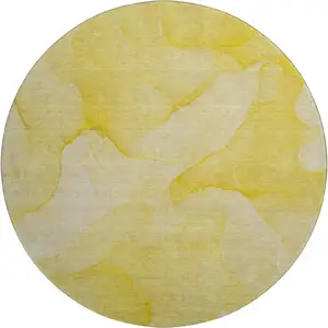 Photo of 8' Gold And Ivory Abstract Washable Round Rug With UV Protection