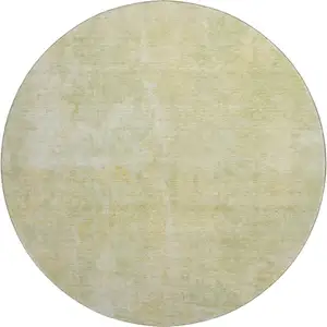 Photo of 8' Gold And Ivory Abstract Washable Round Rug With UV Protection