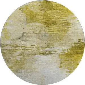 Photo of 8' Gold And Ivory Abstract Washable Round Rug With UV Protection