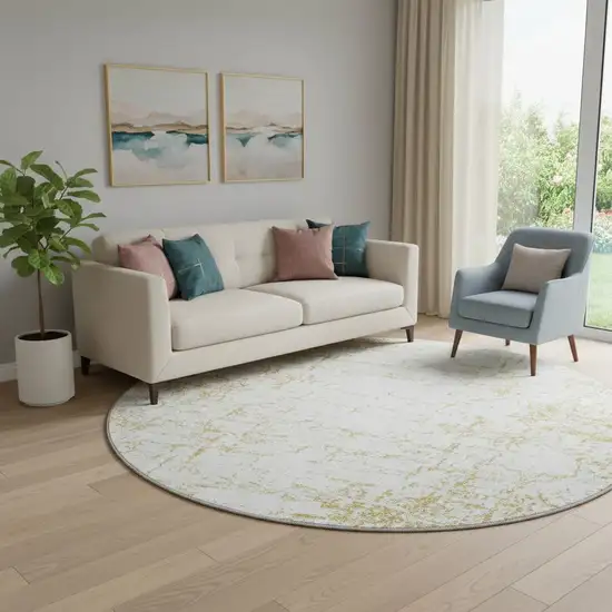 8' Gold And Ivory Abstract Washable Round Rug With UV Protection Photo 1