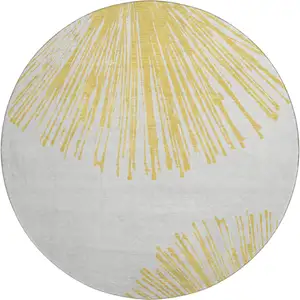 Photo of 8' Gold And Ivory Abstract Washable Round Rug With UV Protection
