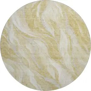 Photo of 8' Gold And Ivory Abstract Washable Round Rug With UV Protection